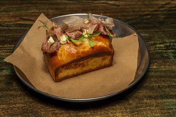 Baked butter brioche sandwich stuffed with tuna and various vegetables with a mild mustard sauce