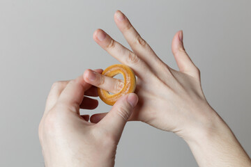 joke photo. the guy puts a bagel on the girl's finger instead of a ring