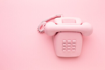 vintage phone on color background