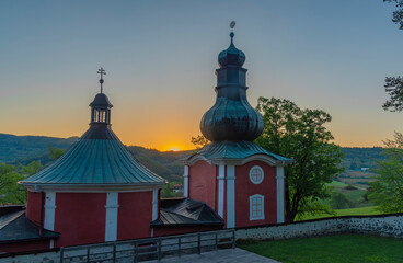 Sunset near old buildings in Banska Stiavnica town in spring evening