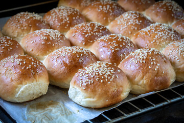 Round white flour buns with sesame seeds