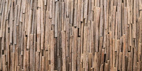 Closeup of bamboo sticks joined together to act as a fence for protection with rough and wood texture and no people around