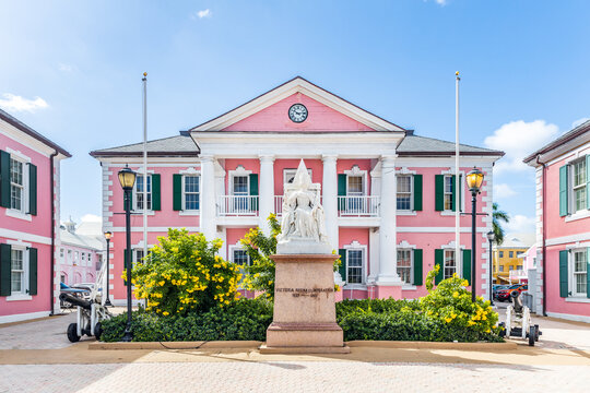 NASSAU, BAHAMAS - OCTOBER 13, 2019: Parliament Square is a group of government buildings that were built in 1815. The buildings are painted in a flamingo pink and are modeled after New Bern, NC.