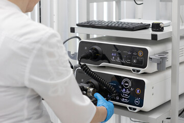Endoscopy in the hospital. The doctor connects the endoscope before gastroscopy. Medical examination