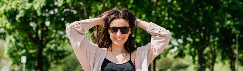 Portrait of a woman enjoy the sun rays with glasses