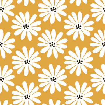 Chamomile on a yellow background. White flowers hand drawn vector illustration. Floral seamless pattern for textile or wallpaper.