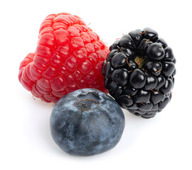 Macro of juicy fresh raspberry, blueberry and blackberry on isolated white background