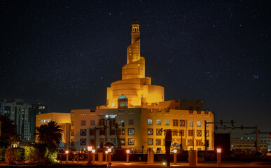 View of fanar building during the night from the souq waqif park