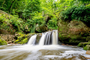 Schiessentümpel waterfall in the region Mùllerthal in Luxembourg