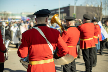 Military band in parade. Trumpeters on street. Trumpeter plays tune. Orchestra in Russia.