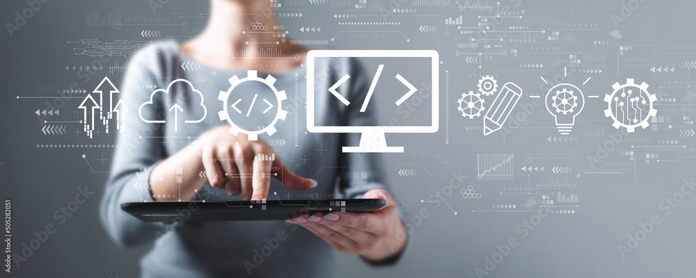 Aufkleber web development concept with business woman using a tablet computer