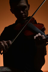 Violin soloist playing his violin © Cavan