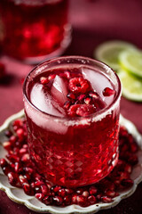 Close up of Pomegranate Margarita with Pink Salt and Raspberries