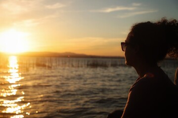 Fototapeta premium person watching sunset
