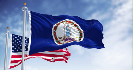 The Virginia state flag waving along with the national flag of the United States of America - 505289002