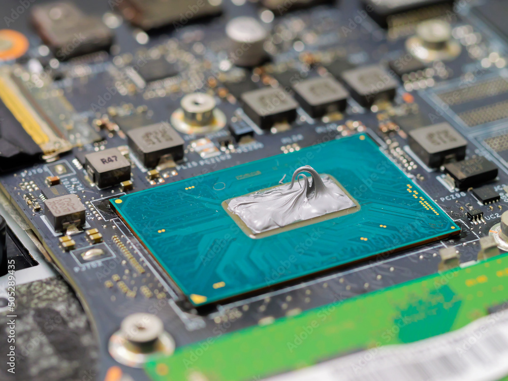 Aufkleber replacing thermal paste on a laptop. applying thermal paste to the laptop processor.