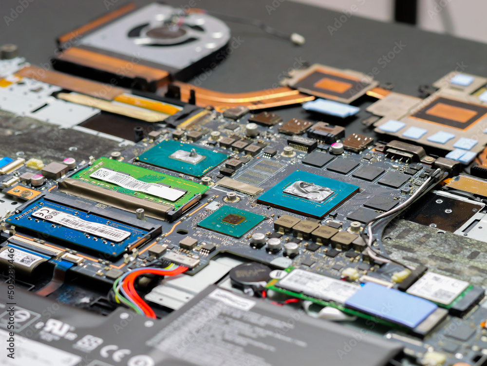 Aufkleber thermal paste compound squeezing on processor and graphics processor of notebook. thermal grease for