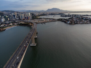 Amazing coastal city one of the capitals of Brazil Vitoria with long bridge over the canal - aerial drone view