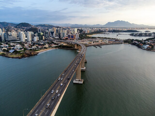 Amazing coastal city one of the capitals of Brazil Vitoria with long bridge over the canal - aerial...