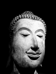 Buddha face in black background