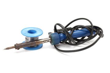 Electric soldering iron with the blue handle and Roll of soldering wire on a white background