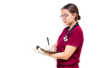 Nurse in burgundy uniform going about her hospital duties on a white background for copy space