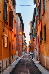 Fototapeta na wymiar View of narrow street at historic centre of Verona, Italy