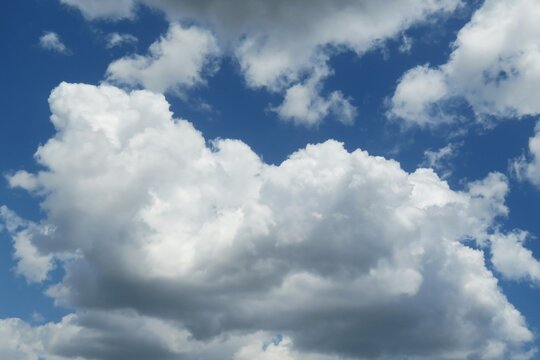 Beautiful big fluffy clouds in blue sky background