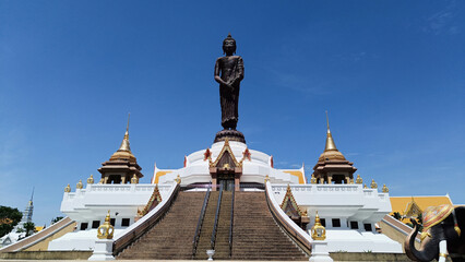 Buddha on sky background at Karen Kathin Temple (Wat Kroen Ka Thin) Lopburi province - obrazy, fototapety, plakaty