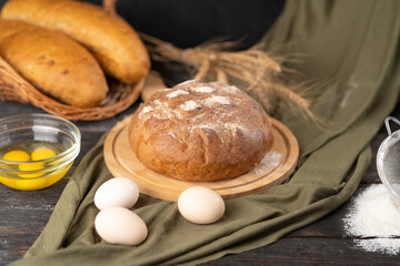 Delicious freshly baked bread on a rustic background