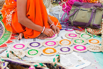 Hand weaving of jute coasters, handicrafts on display during the Handicraft Fair in Kolkata....
