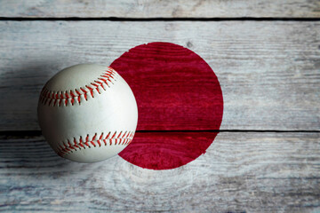 Leather Baseball on Rustic Wooden Background Painted With Japanese Flag