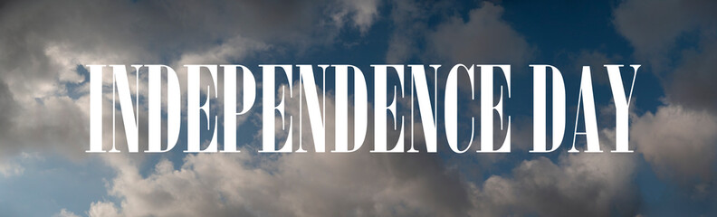 "Independence day" sign amongst the clouds. A 4th of July high resolution banner concept.