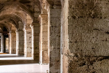 Massive columns of interior of the famous Colosseum of city of Rome, Lazio, Italy, Europe. UNESCO...