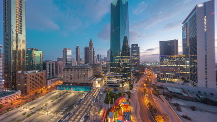 Dubai International Financial district aerial night to day timelapse. Panoramic view of business...