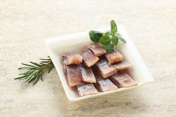 Delicous sliced herring fillet in grape sauce