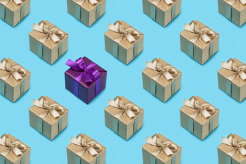Gift boxes in festive packaging on blue. Background pattern, close-up.