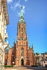 Fototapeta na wymiar Riga, Latvia - June 26, 2015: Front view of St. Gertrude Old Church. During dramatic history since XV century church was demolished and rebuilt six times.