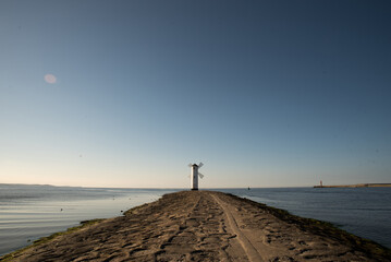Scenic view of the old mill lighthouse at sunrise. Swinoujscie. Poland.lighthouse mill © Dmytrii