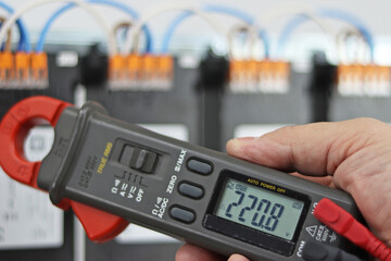 Multimeter for measuring equipment parameters in close-up.