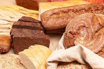 Different types of bread with wheat ears