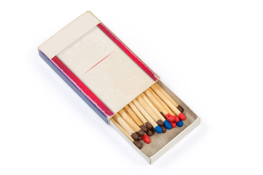 Wooden household safety matches with multicolored heads in cardboard matchbox