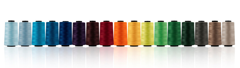 Spool of sewing thread, isolated on white background. Colored yarns used by factories in the clothing industry. Threads wound on the spool. Colored reels - Powered by Adobe