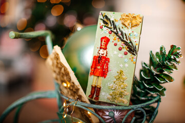 A close-up of a holiday-themed Nutcracker decoration, set against a backdrop of Christmas ornaments...
