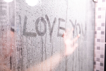 text I love you on shower glass