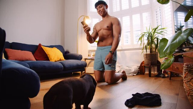 Young shirtless Asian man exercising