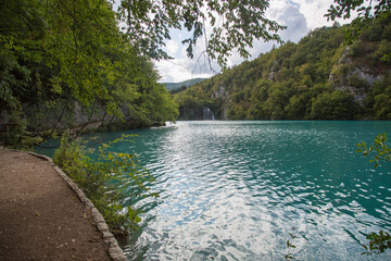Plitvice Lakes National Park, Croatia, Europe: View to the beautiful turquoise water and the waterfall in the background