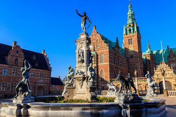 Fototapeta na wymiar Neptune Fountain in a front of Frederiksborg castle in Hillerod, Denmark