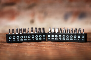 Sets of bits and drills for a screwdriver with appropriate designations, selective focus, space for...