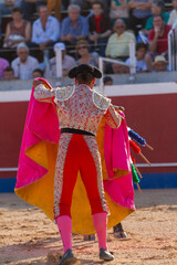 a Spanish bullfighter during his performance in the bullfight